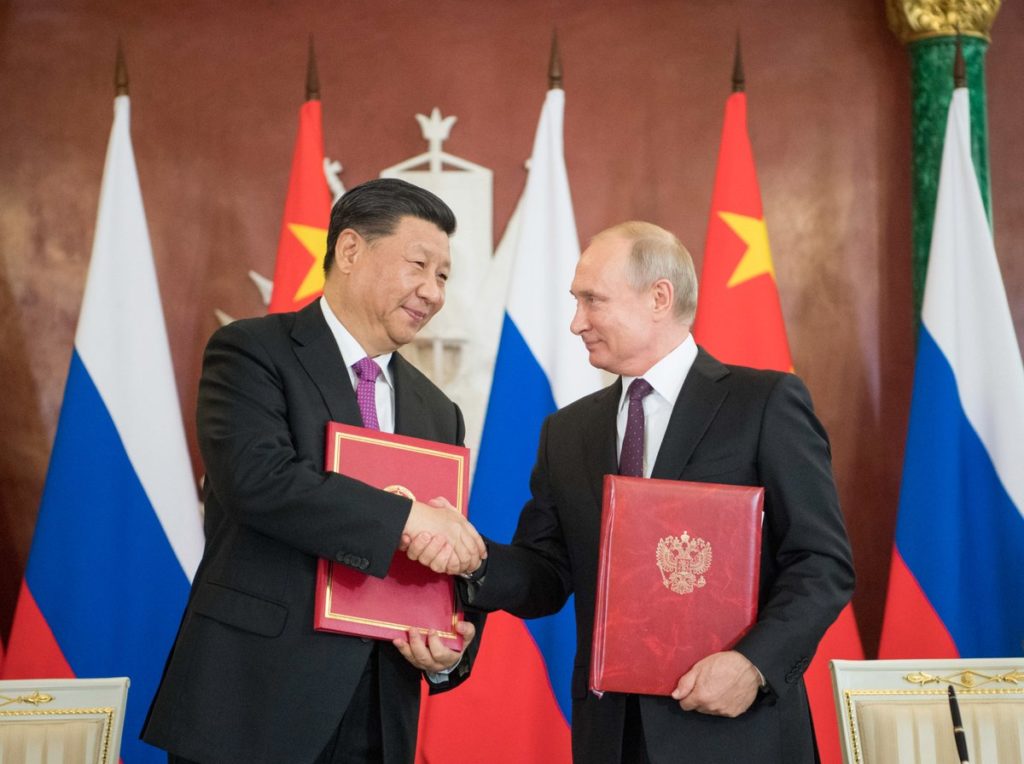 190605-Putin and Xi meet in Moscow to strengthen their alliance.